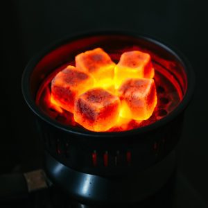 burning charcoal briquette